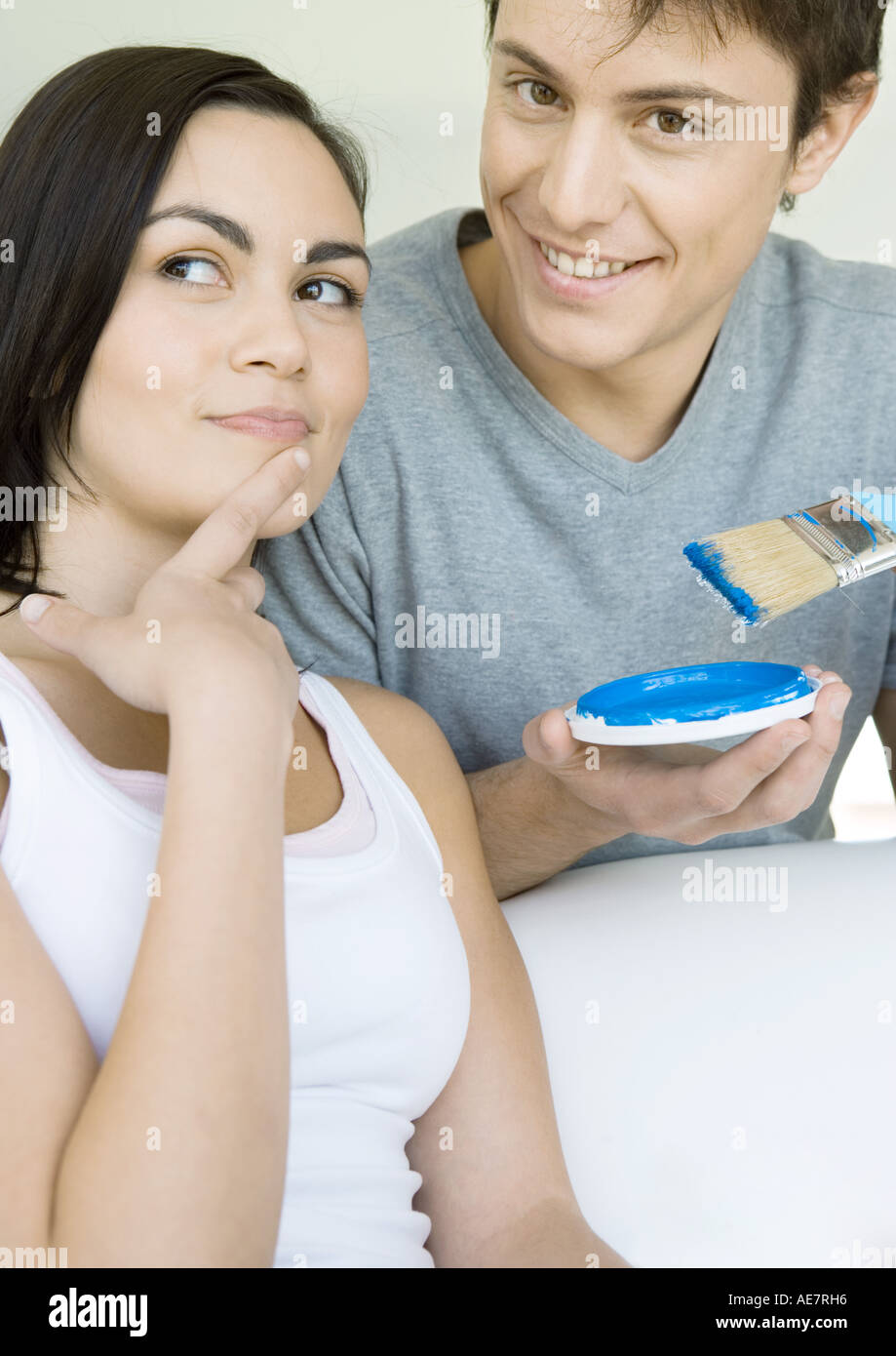 Couple deciding on paint color Stock Photo