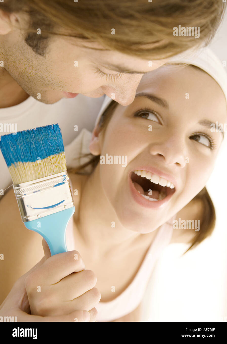 Couple with paintbrush Stock Photo