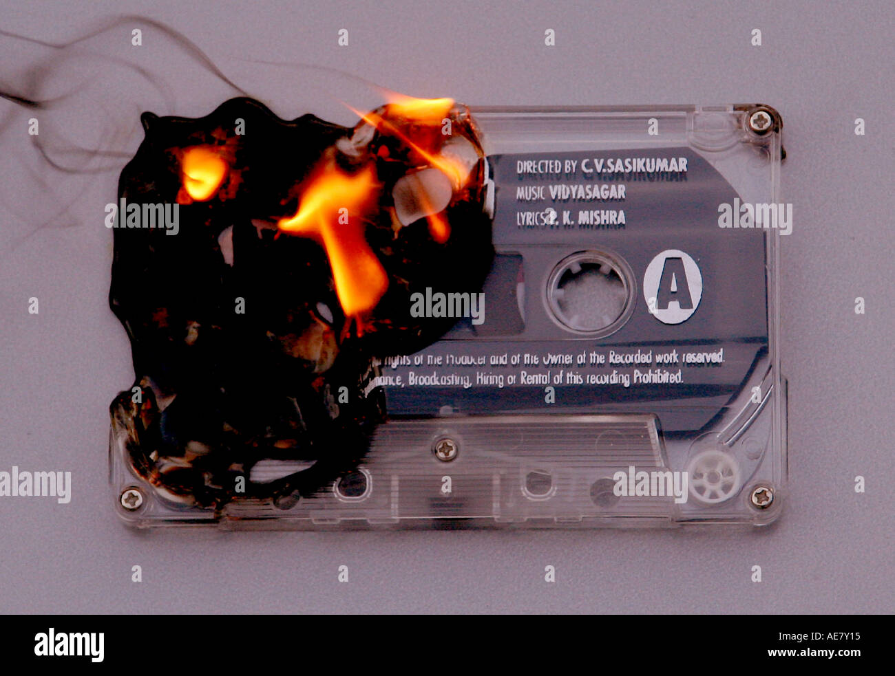 an audio cassette captured whilst burning Stock Photo - Alamy