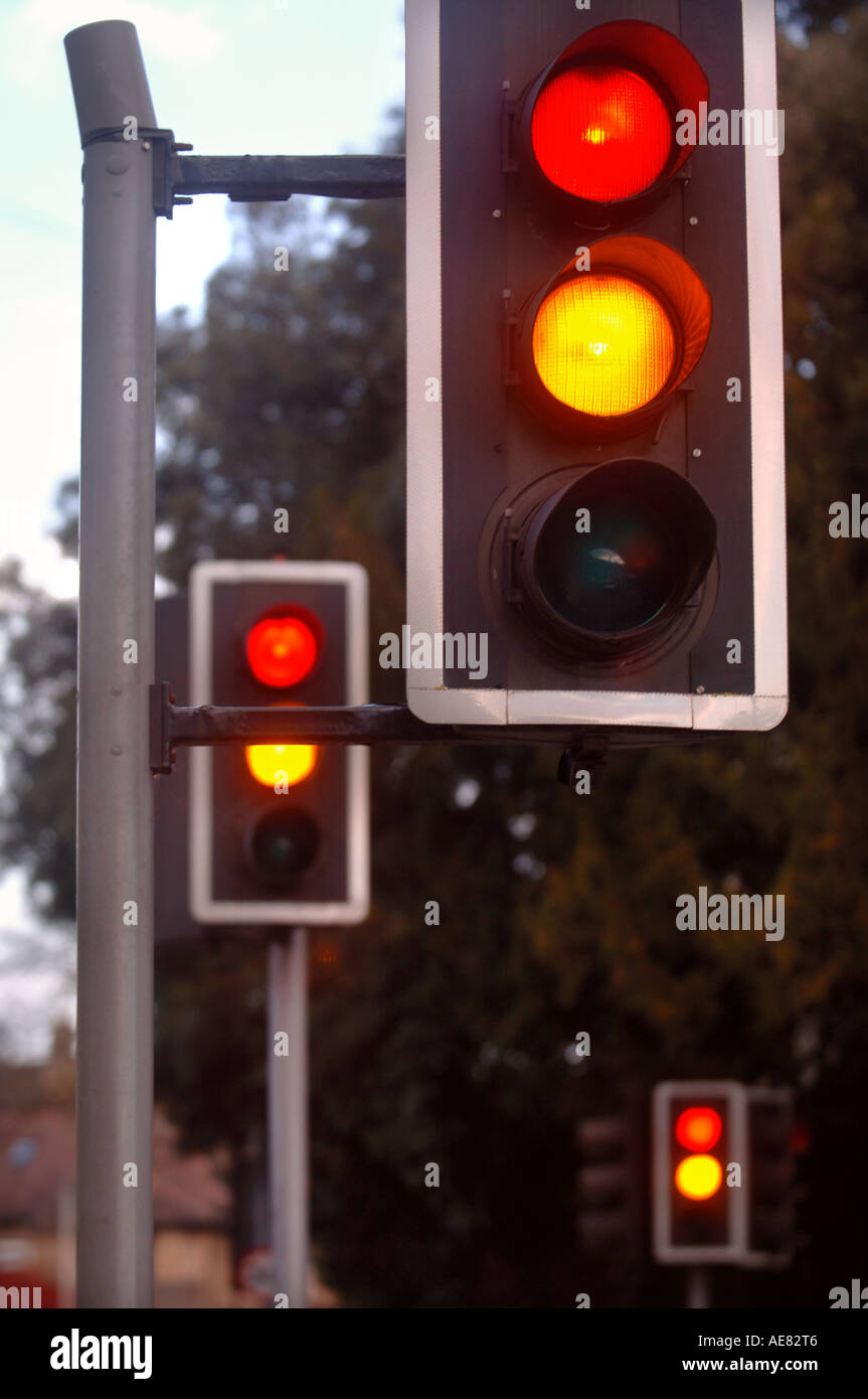 TRAFFIC LIGHTS SHOWING AMBER AND RED AT A CROSSROADS IN THE UK Stock