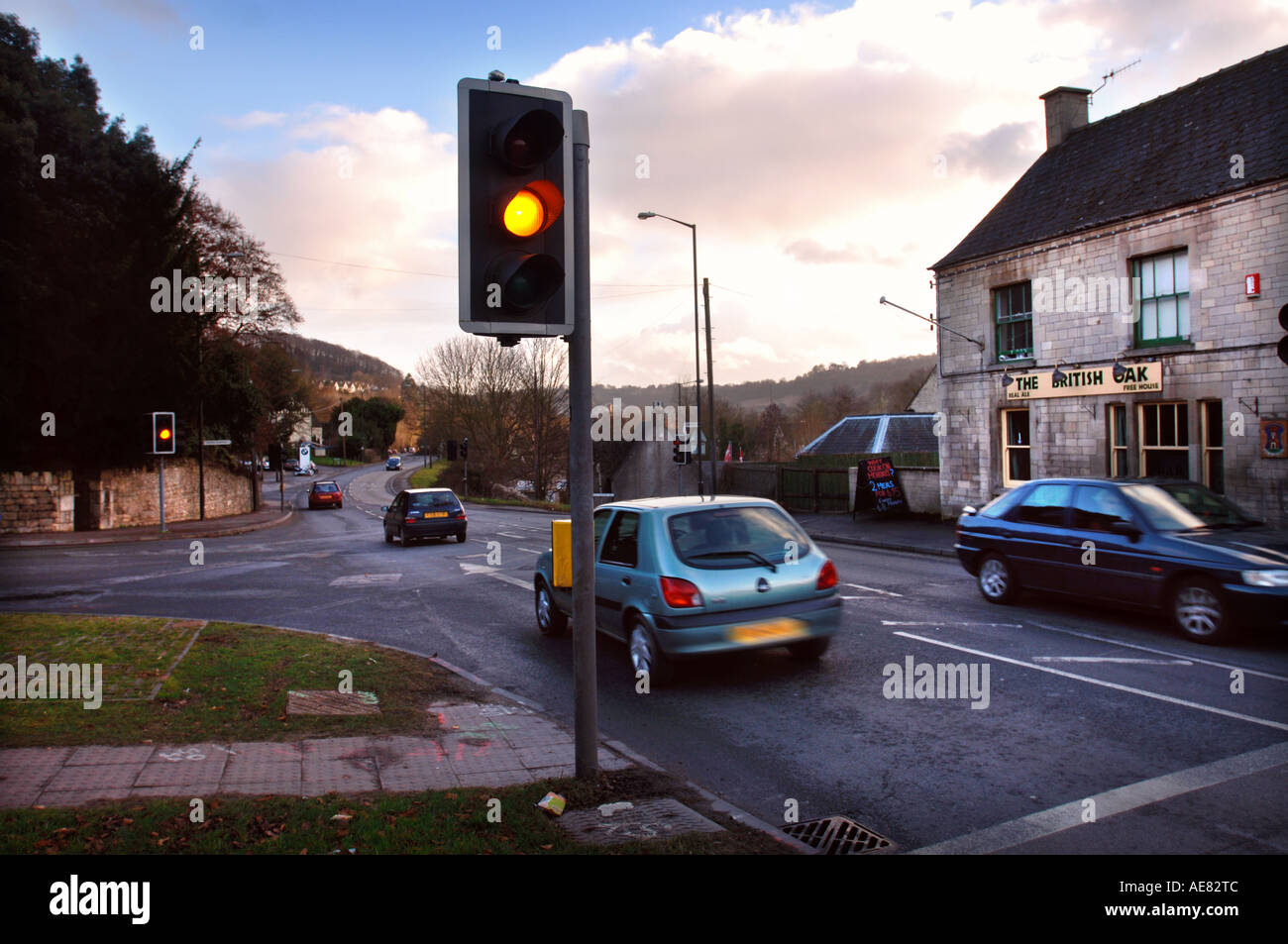 TRAFFIC LIGHTS SHOWING AMBER AT A CROSSROADS IN THE UK Stock Photo Alamy
