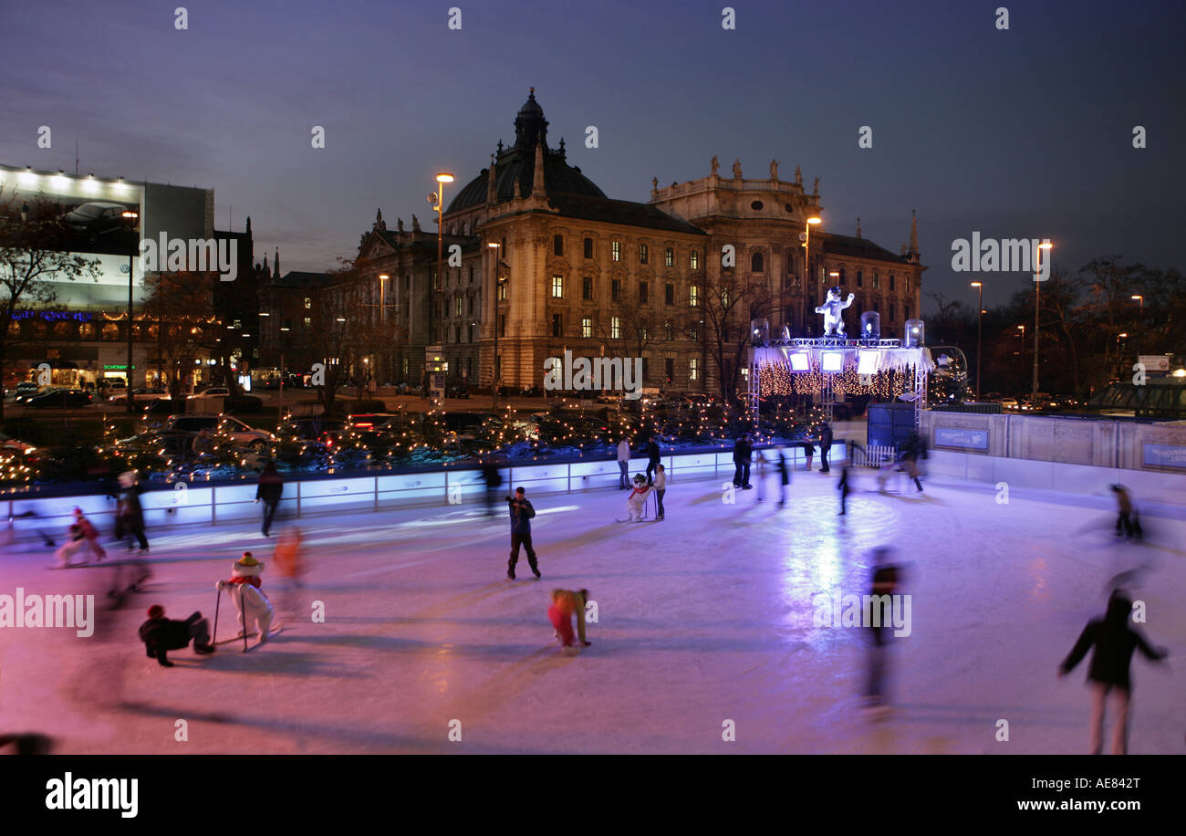 People Ice Skating outside at karlsplatz Munich at christmas in germany