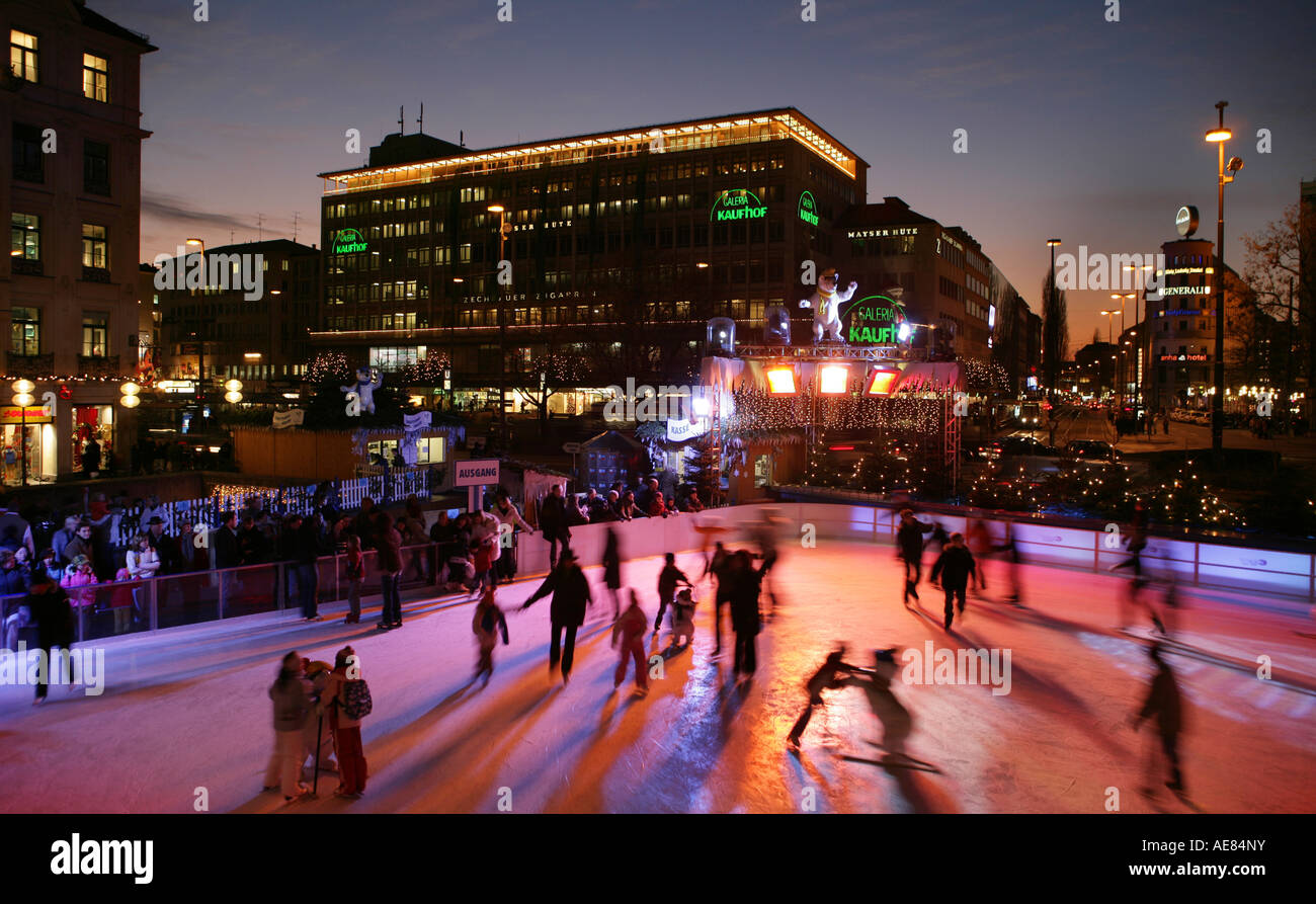 People Ice Skating outside at karlsplatz Munich at christmas in germany