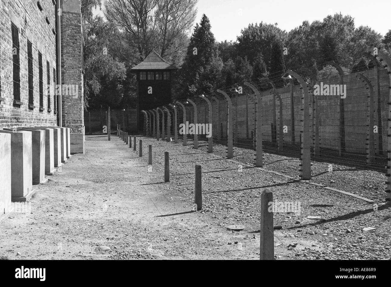 Perimeter fence and prison block at Auschwitz, Poland. Stock Photo