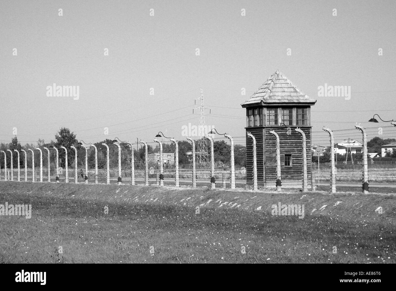 Watch tower and fence alongside Auschwitz-Birkenau, Oswiecim, Poland. Stock Photo