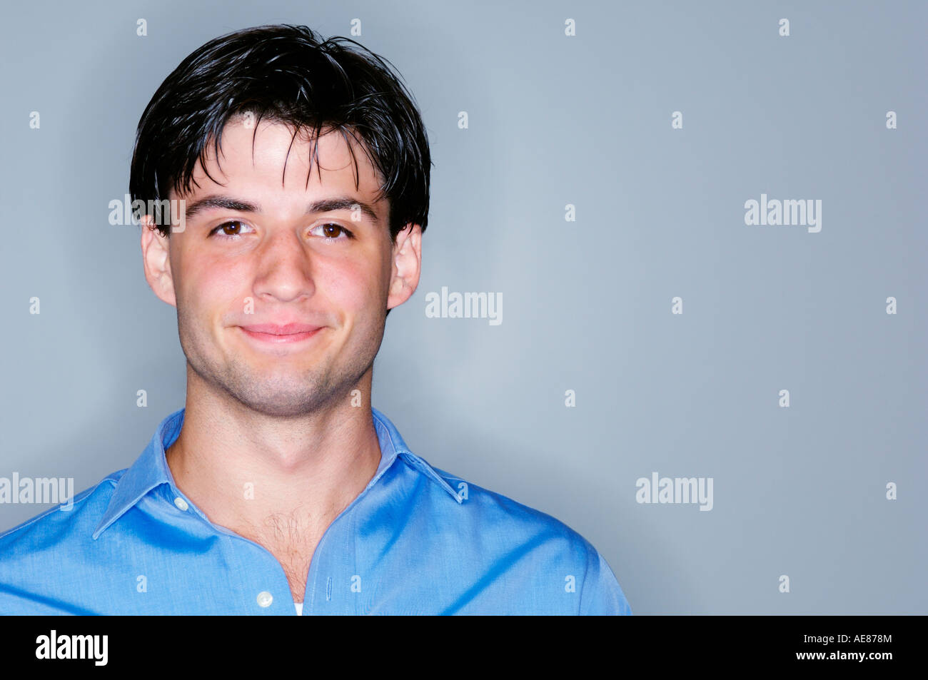 Portrait of young man smiling at the camera Stock Photo - Alamy