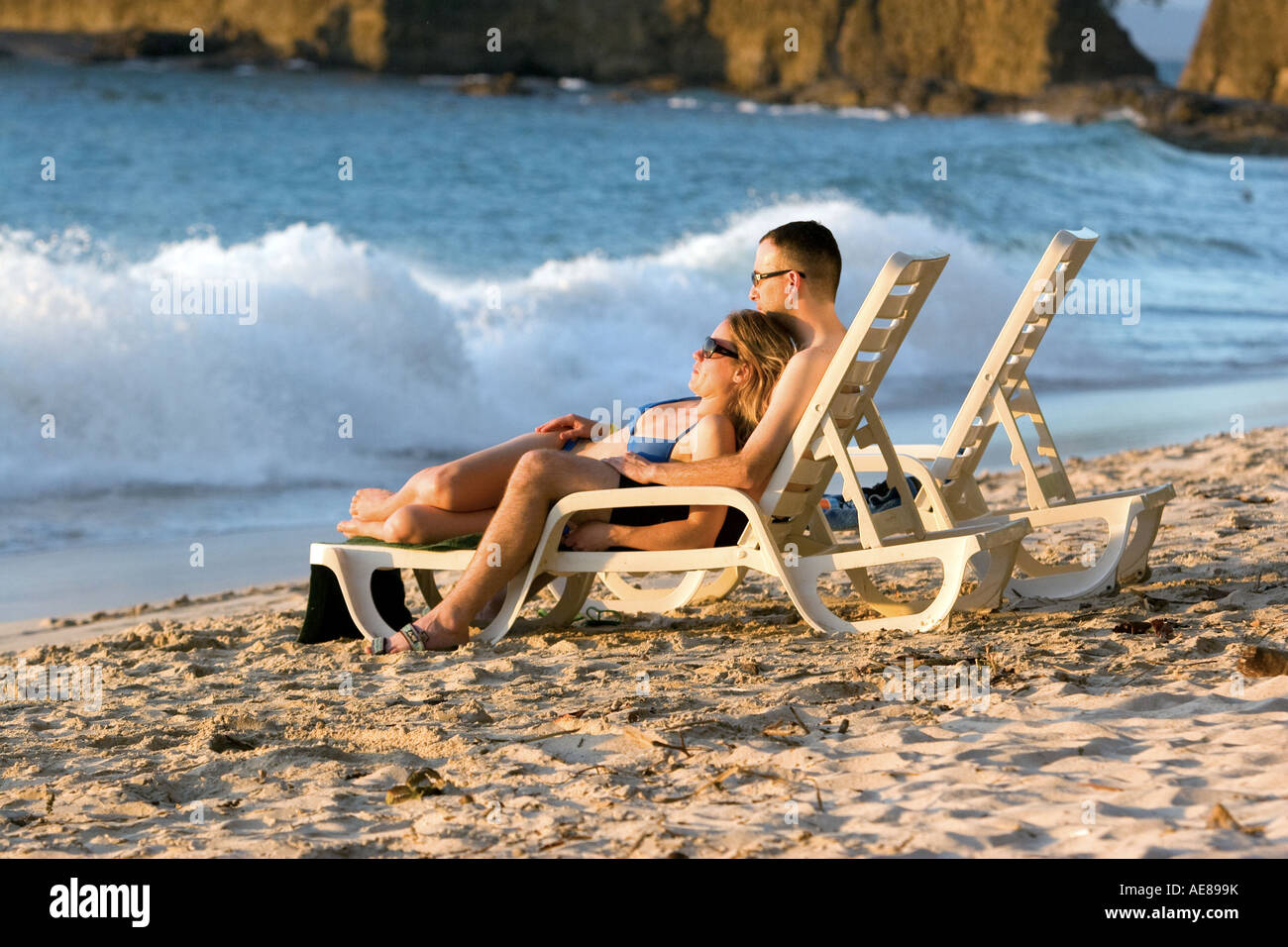 couple lying on the beach Stock Photo - Alamy
