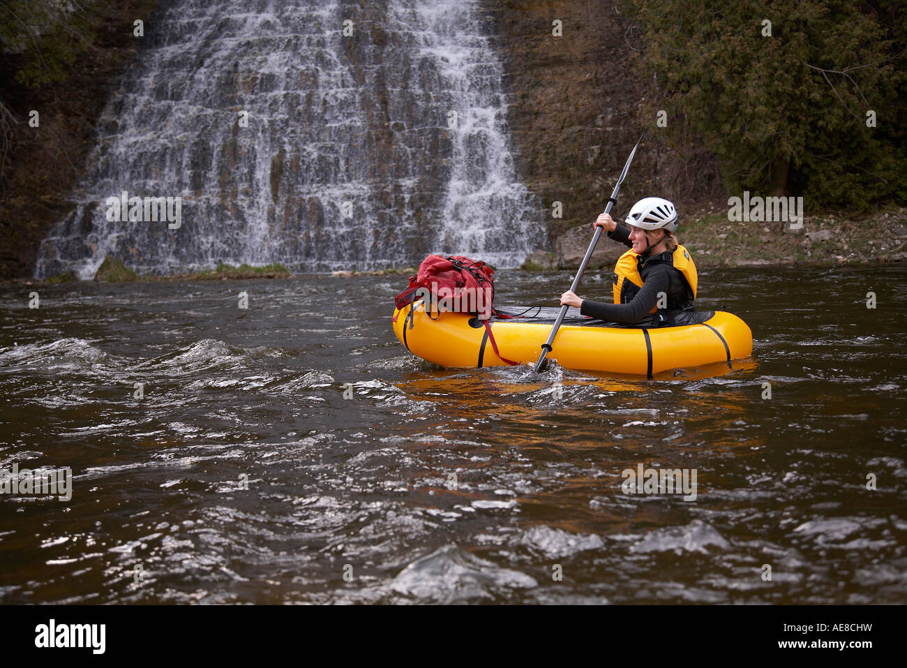 Woman in packraft on Grand River Ontario Canada Stock Photo