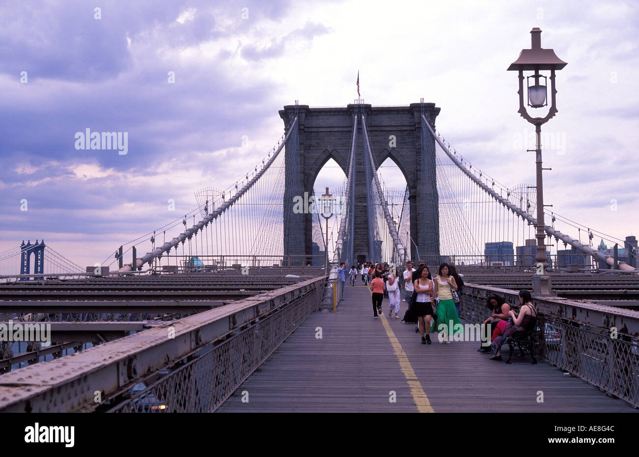 People walking across the Brooklyn Bridge NY USA Stock Photo - Alamy