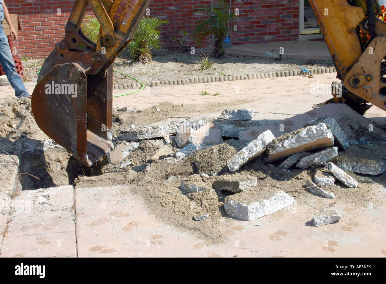 Construction Workers digging a Hole in a Concrete Slab Stock Photo Alamy