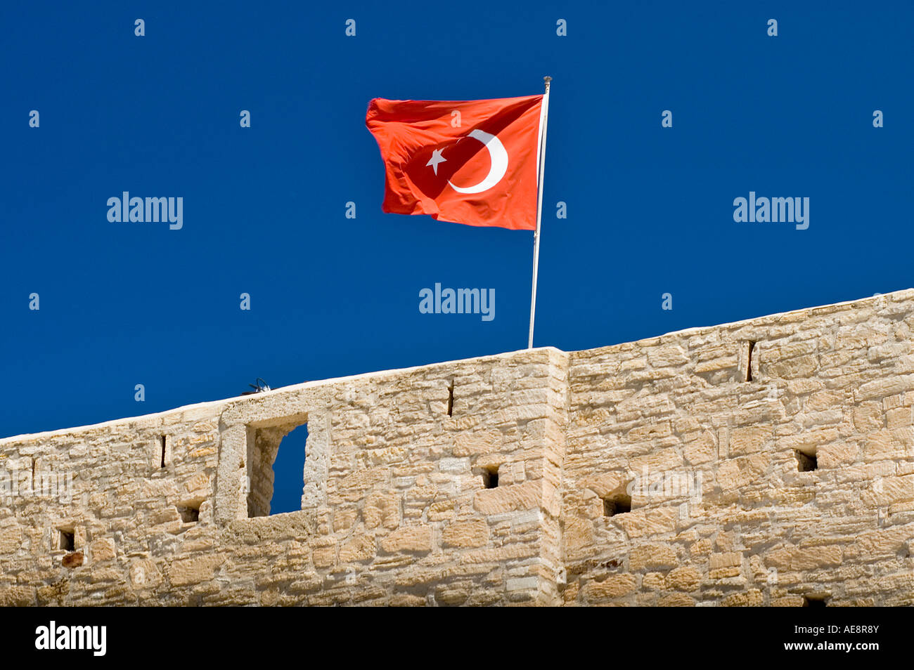 Cesme Fort ( 1508 ) and Turkish Flag , Aegean , Turkey Stock Photo