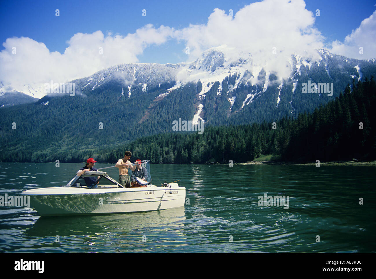 Anglers netting chinook salmon in Glacier Bay Knight Inlet British ...