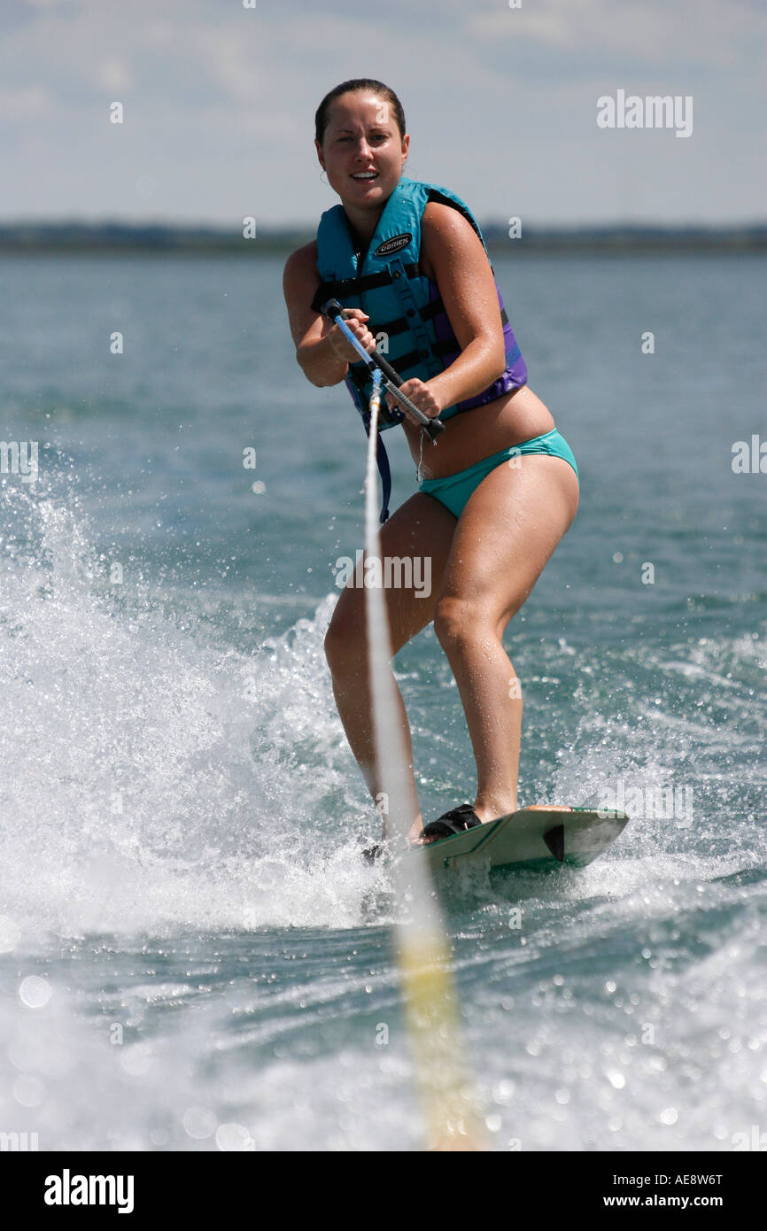 Young woman riding a wakeboard. Stock Photo