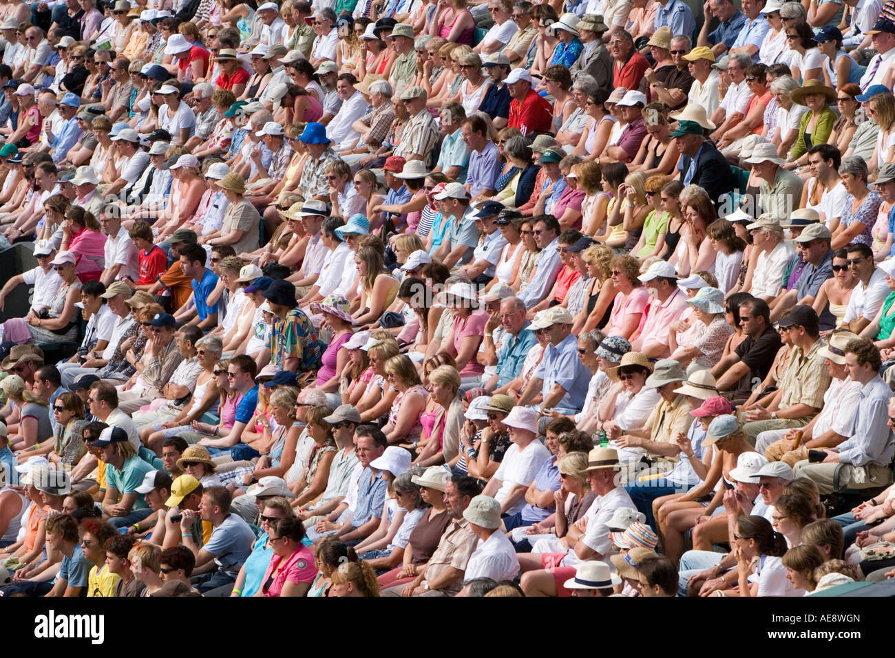 Crowds of people watching tennis match at Wimbledon , London , England . Stock Photo