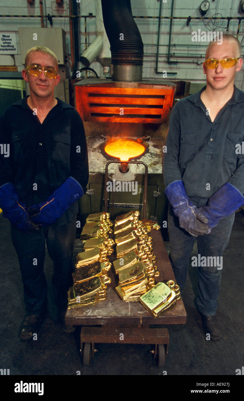 Freshly poured ingots of 100% pure gold with melting crucible Perth, Western Australia, vertical, Stock Photo