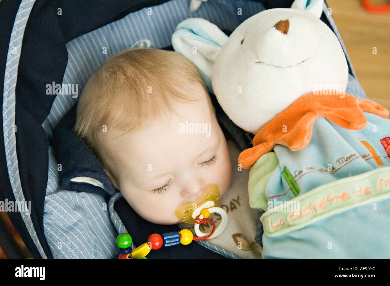 Baby sleeping, stuffed toy Stock Photo