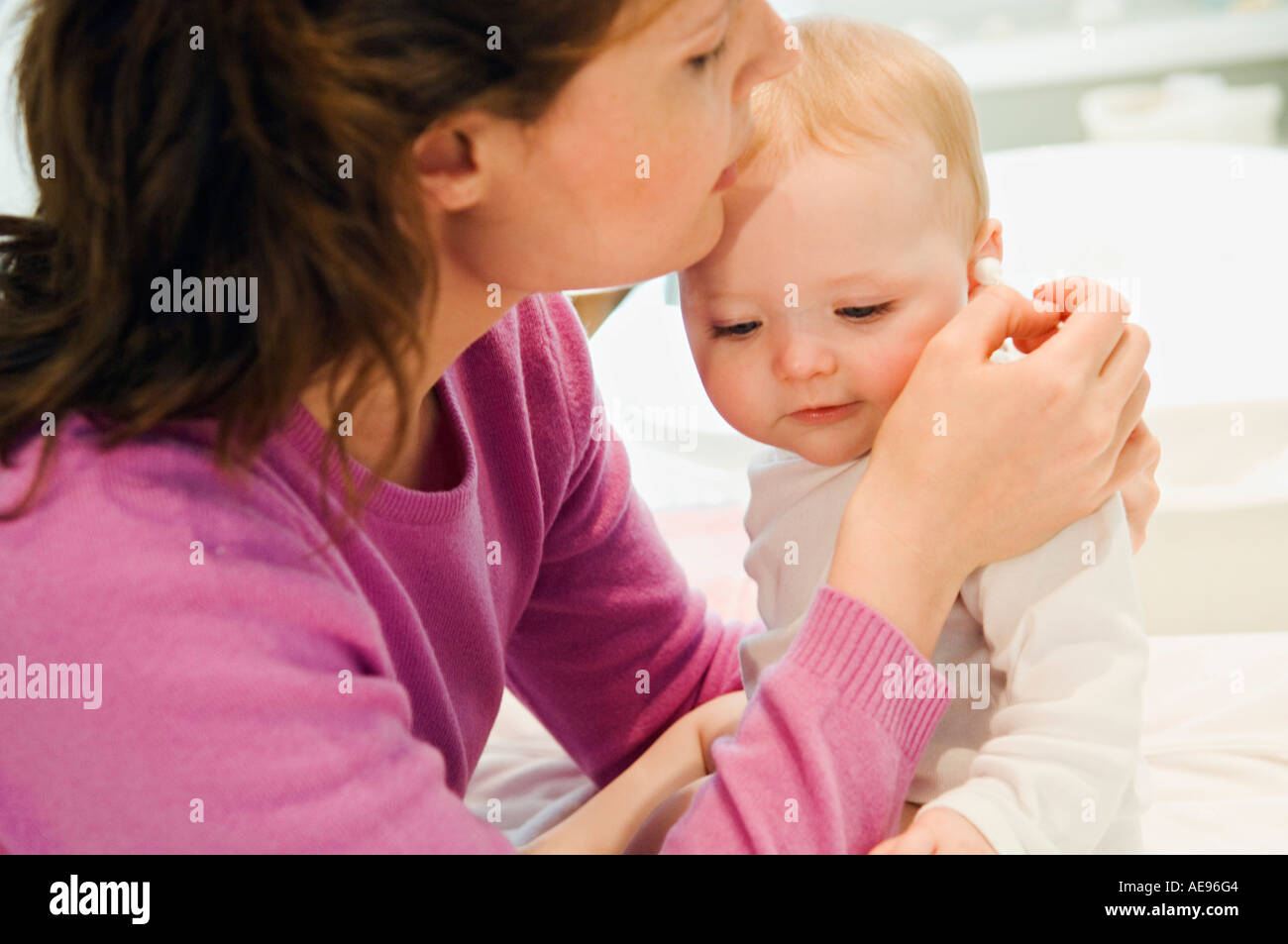 Mother and baby, ears care Stock Photo Alamy
