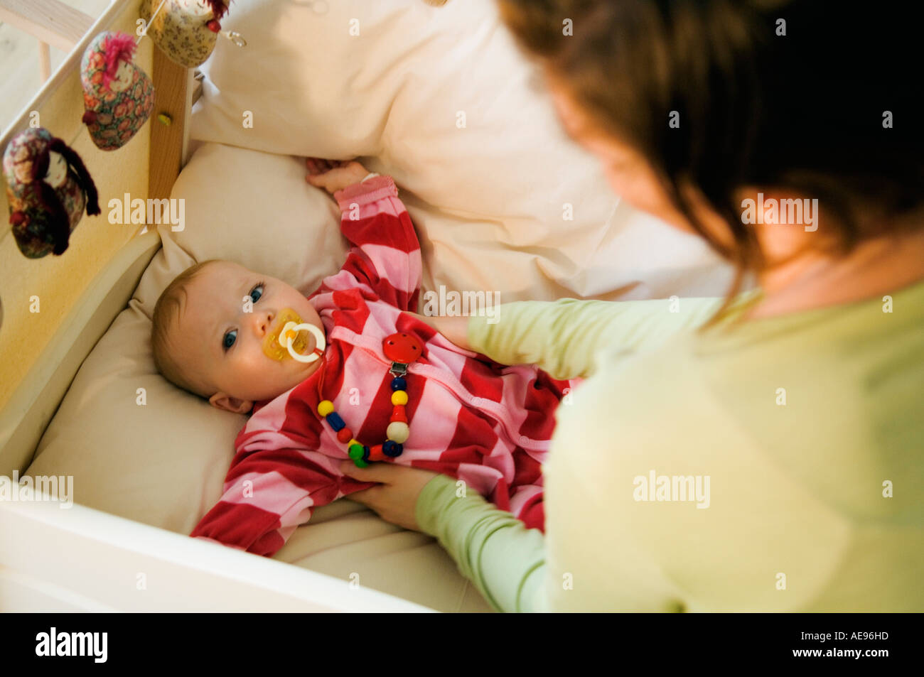Woman sleeping with down comforter hires stock photography and images