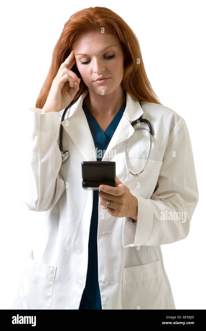 Doctor looking at pager Stock Photo Alamy