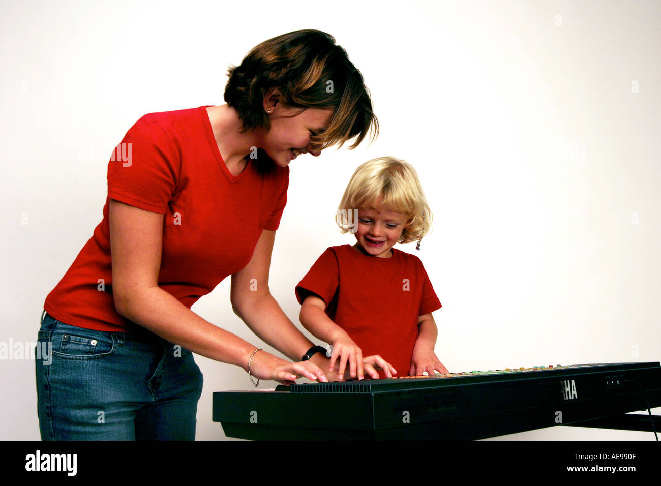 learning piano little girl Stock Photo Alamy