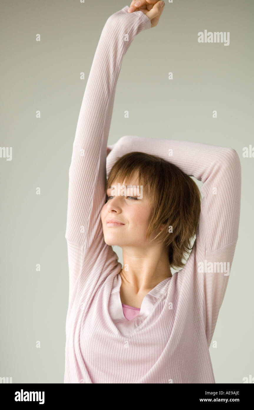 Portrait of a young woman stretching Stock Photo