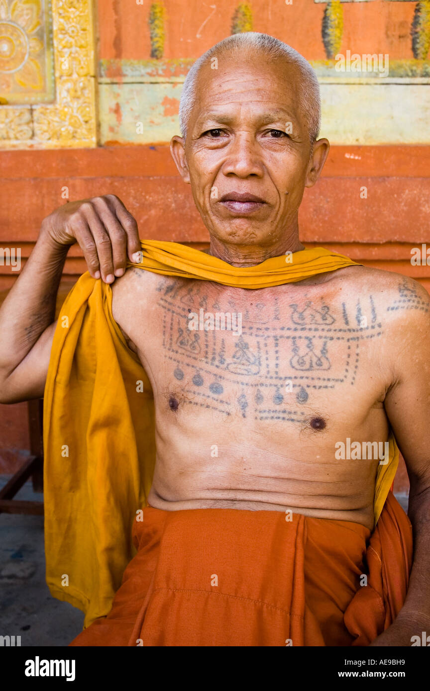Stock photo of an elder monk displaying his tattoos at Bakong Monastery  outside Bakong temple near Angkor Wat in Cambodia Stock Photo - Alamy
