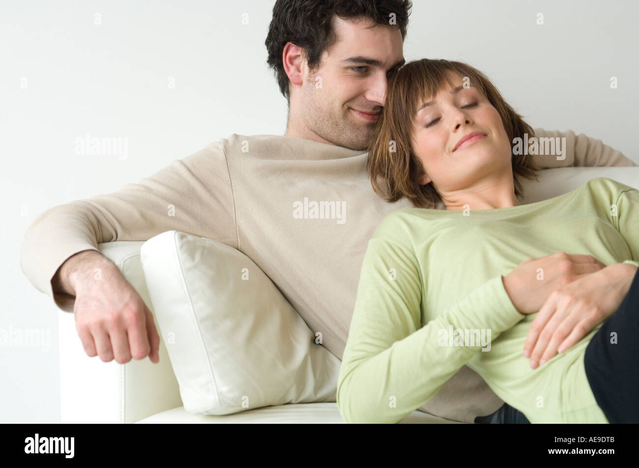 Couple lying on a sofa Stock Photo