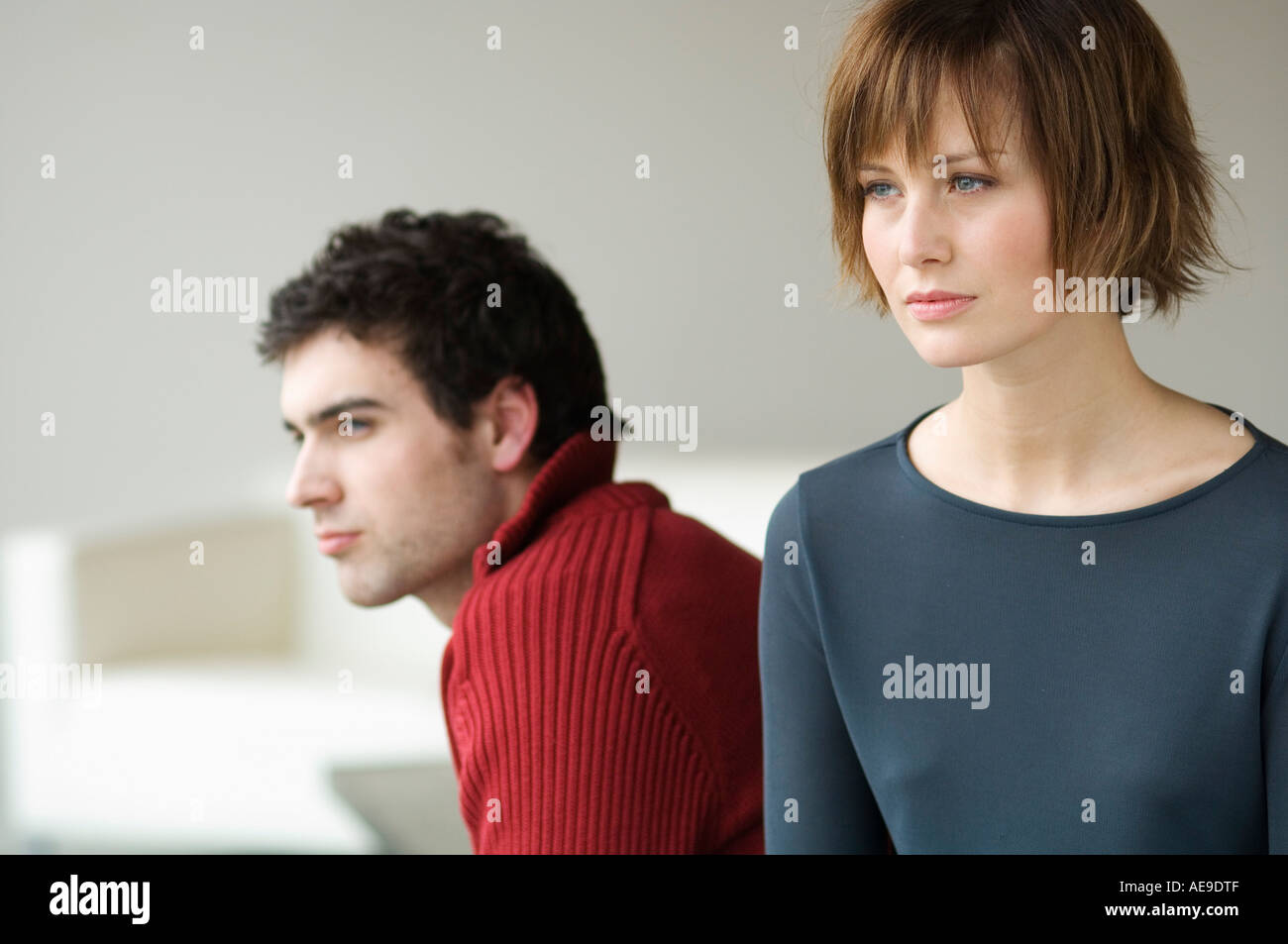 Sad looking couple, interiors Stock Photo