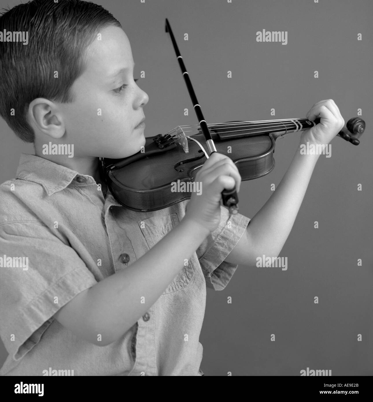 Young boy playing violin Stock Photo Alamy