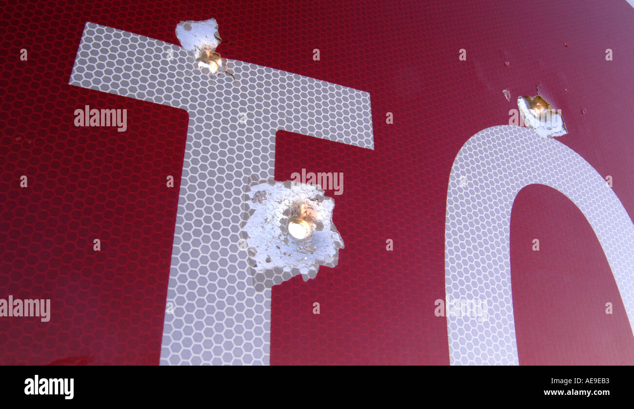 Stop sign with bullet holes Stock Photo - Alamy