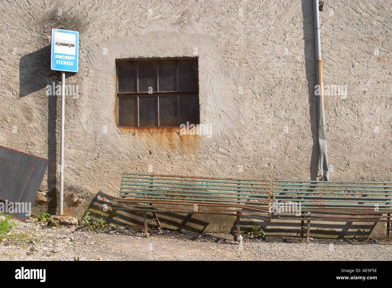 Old But Still In Use Bus Stop With Green Benches Calenzano