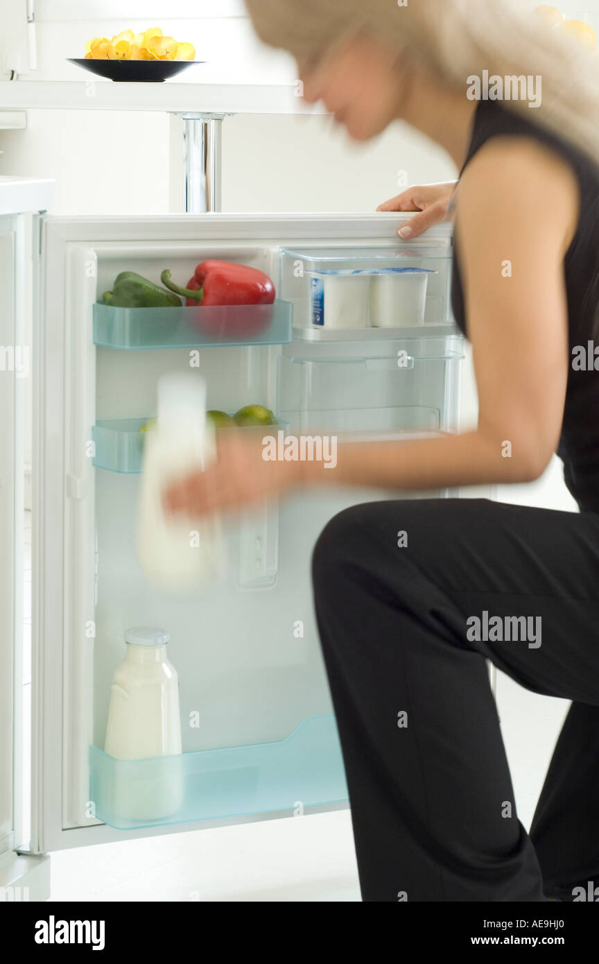Woman looking in refrigerator Stock Photo