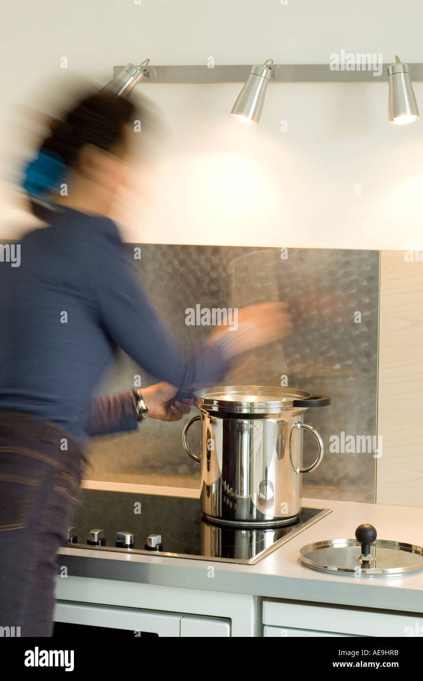 Woman Cooking In A Steam Cooker Stock Photo Alamy