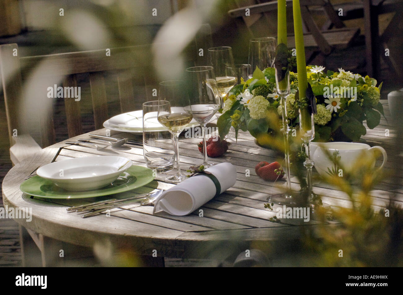 Summer garden table set for three courses Stock Photo - Alamy