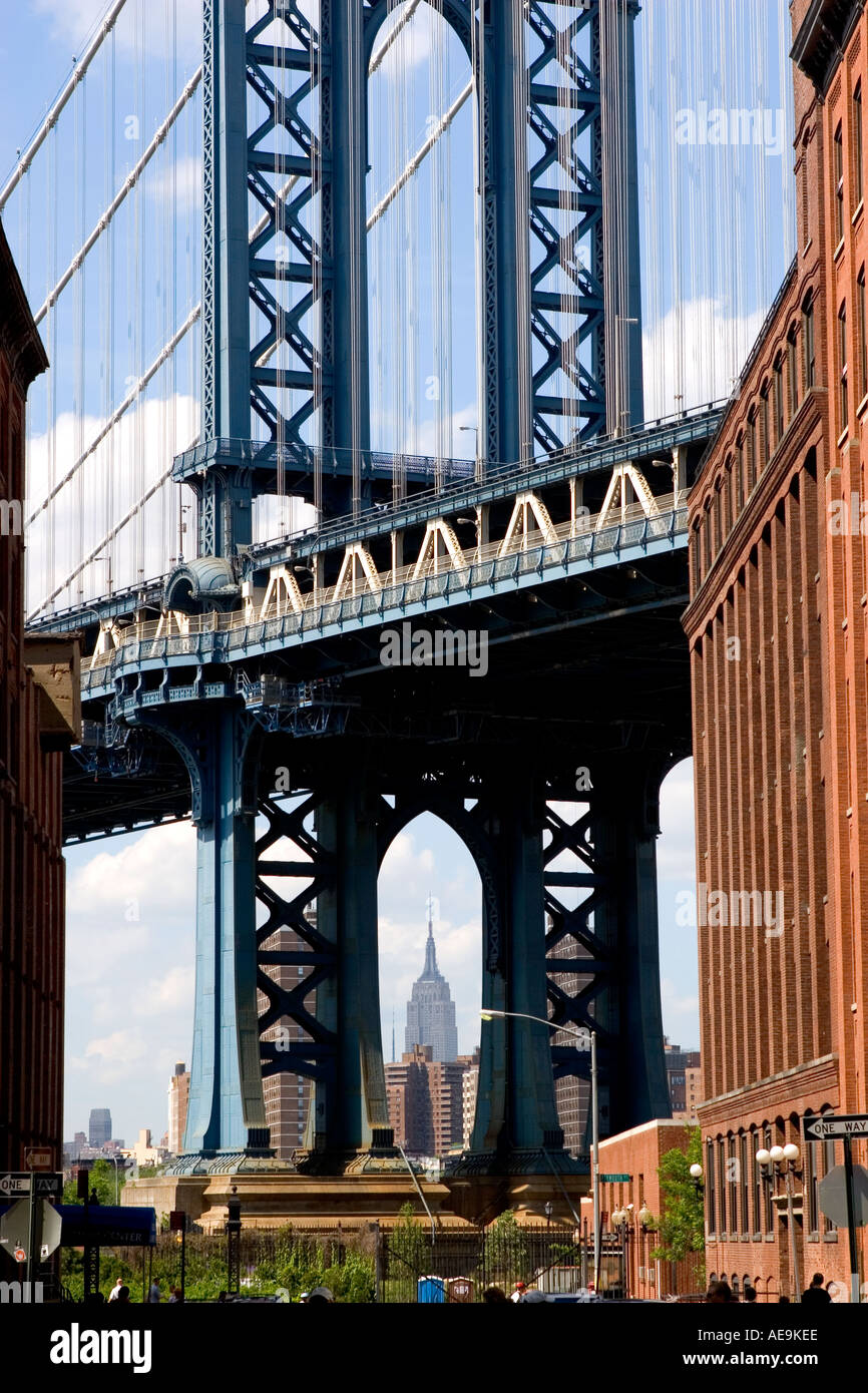 Empire state building seen through the Manhattan Bridge DUMBO Brooklyn NY USA Stock Photo