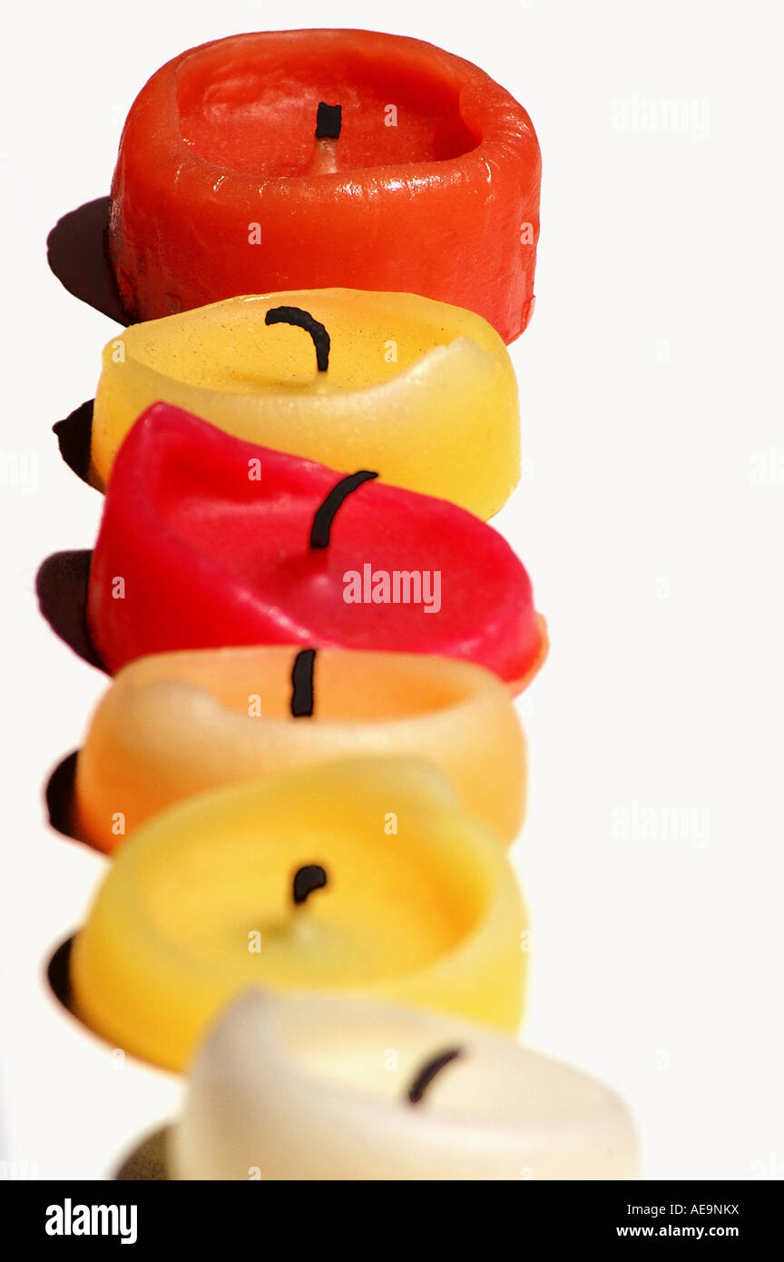 row of blown out coloured candles Stock Photo Alamy