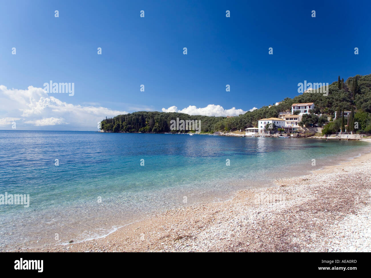 The beach at Kalami Corfu with the White House previously occupied by Lawrence Durrel Stock Photo