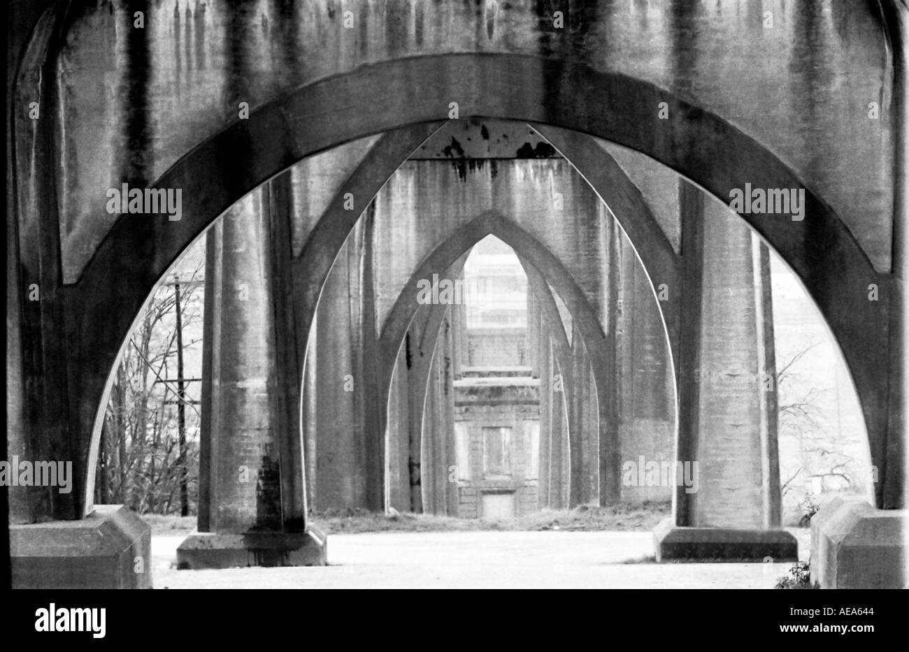 Arches form a geometric perspective in this view under the St Johns bridge in Portland Oregon Stock Photo