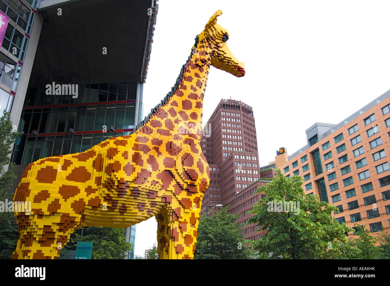 large figure TOY Giraffe made of lego brick ahead of SONY CENTER BERLIN Stock Photo