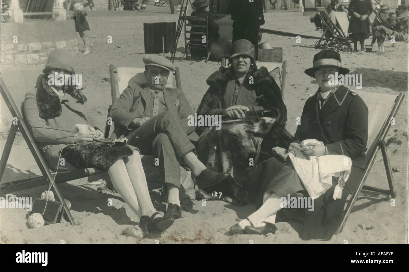 Group of friends enjoying the sun on Bournemouth beach circa 1925 Stock Photo