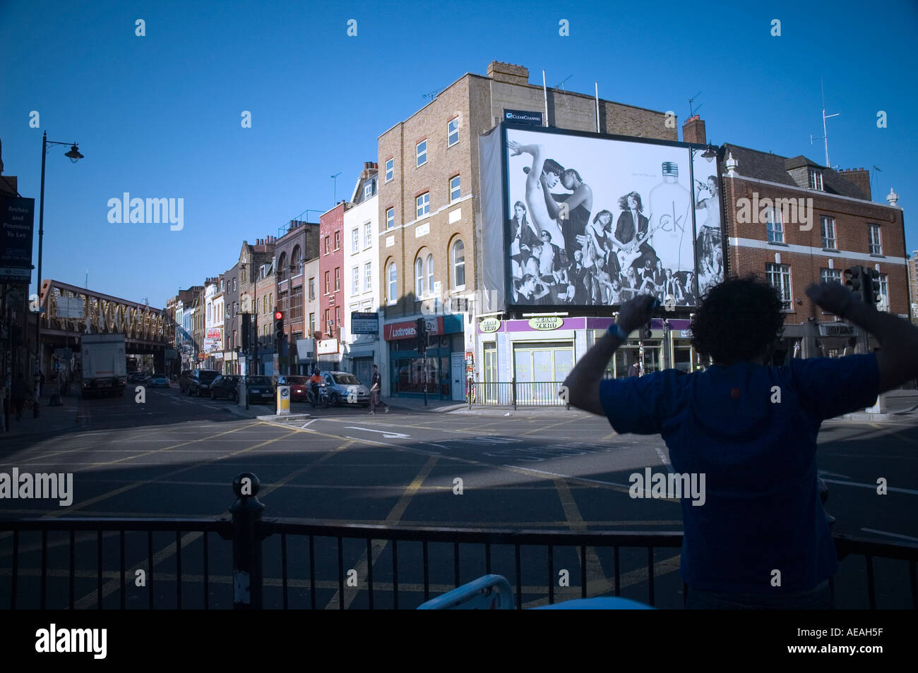 Rear view of a person looking at Calvin Klein advertisement, Kingsland  Road, Hackney, England Stock Photo - Alamy
