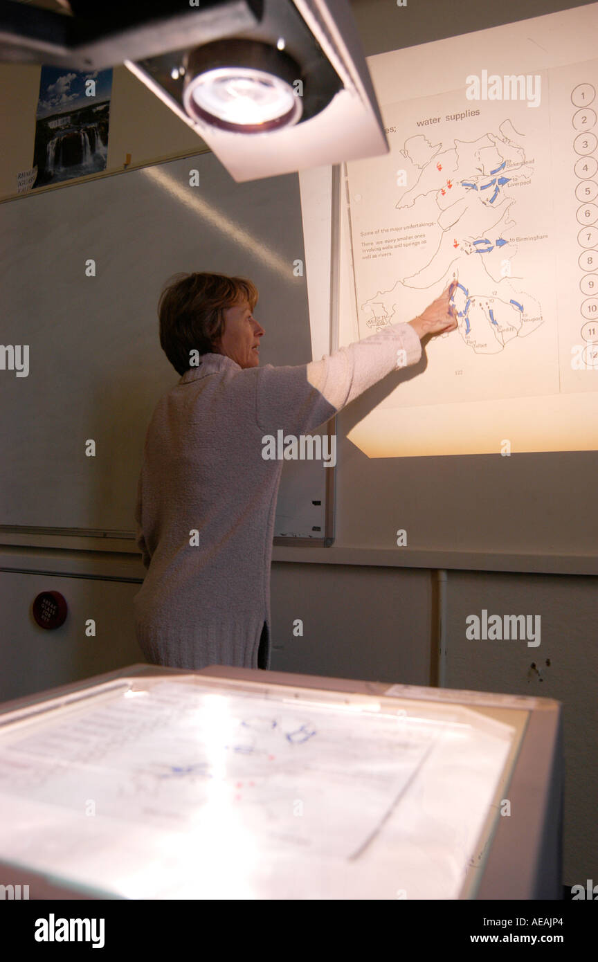 A woman lecturer teaching geography at Aberystwyth University, using an