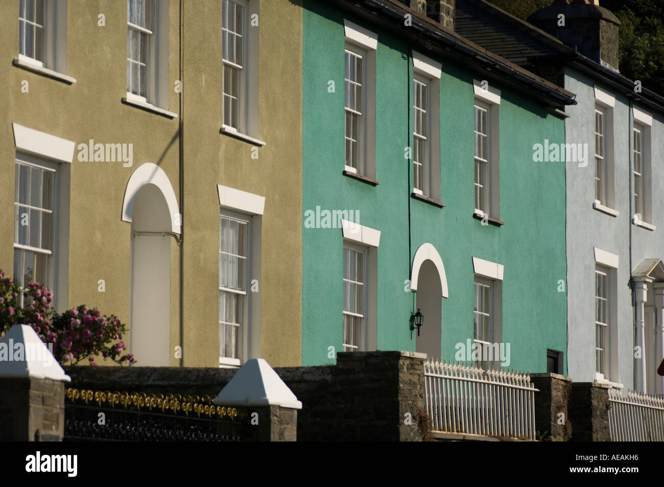 A terrace of pastel painted Nash style houses in Aberaeron Ceredigion