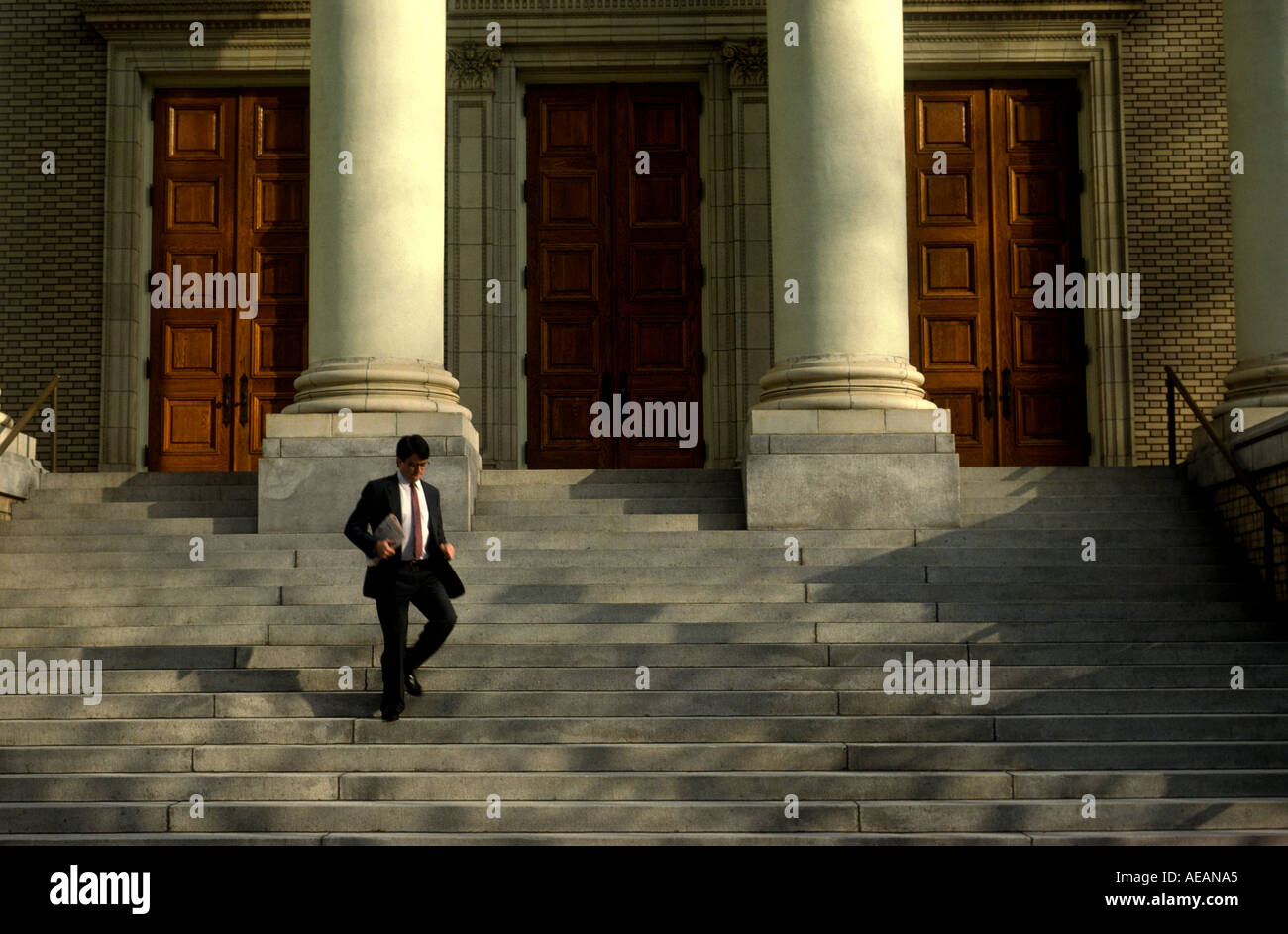 A lawyer leaves the courthouse on his way back to his office Stock Photo