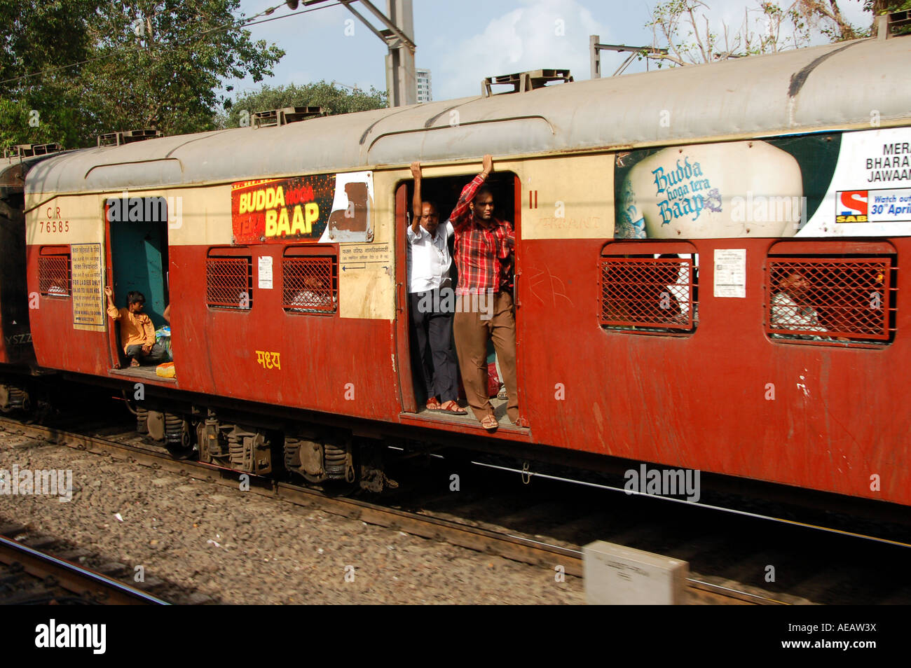 People on Indian train carriage in Mumbai / Bombay, India Stock Photo