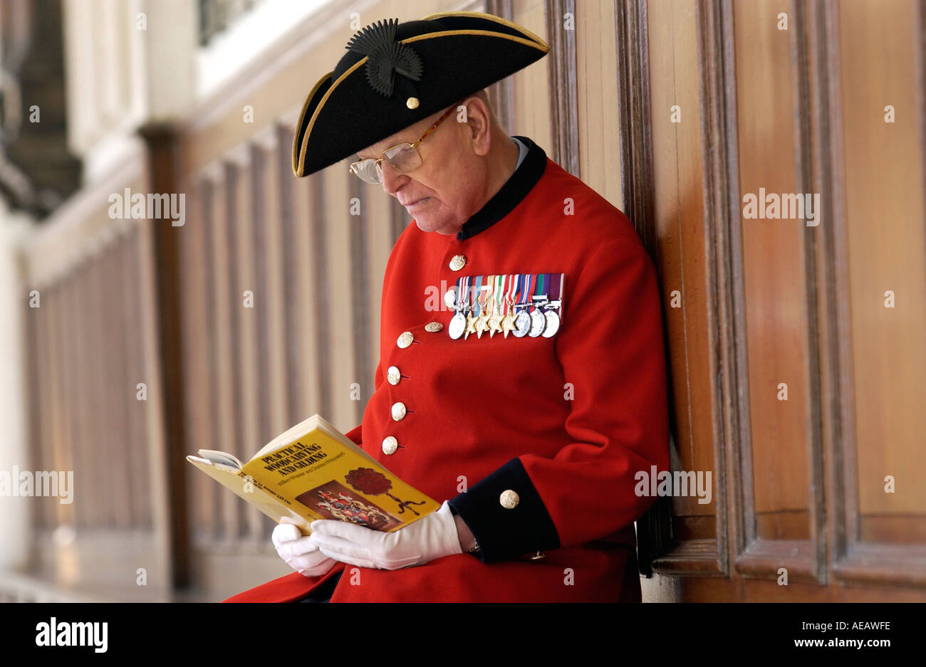 War Veteran Chelsea Pensioner Alan Gale at home at the Royal Hospital Chelsea in uniform with his military medals London Stock Photo