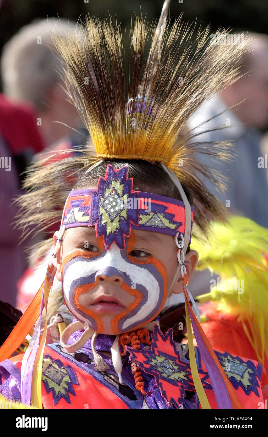 YOUNG CREE FIRST NATION BOY WITH FACE PAINTED IN TRADITIONAL COSTUME REGINA CANADA Stock Photo
