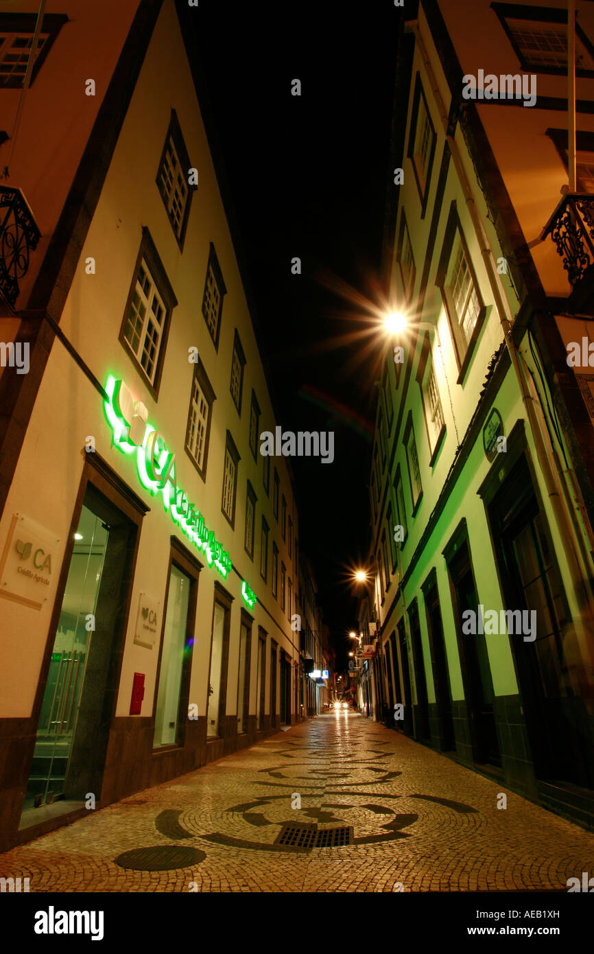 Night photo of narrow street in downtown Ponta Delgada. Azores islands, Portugal Stock Photo