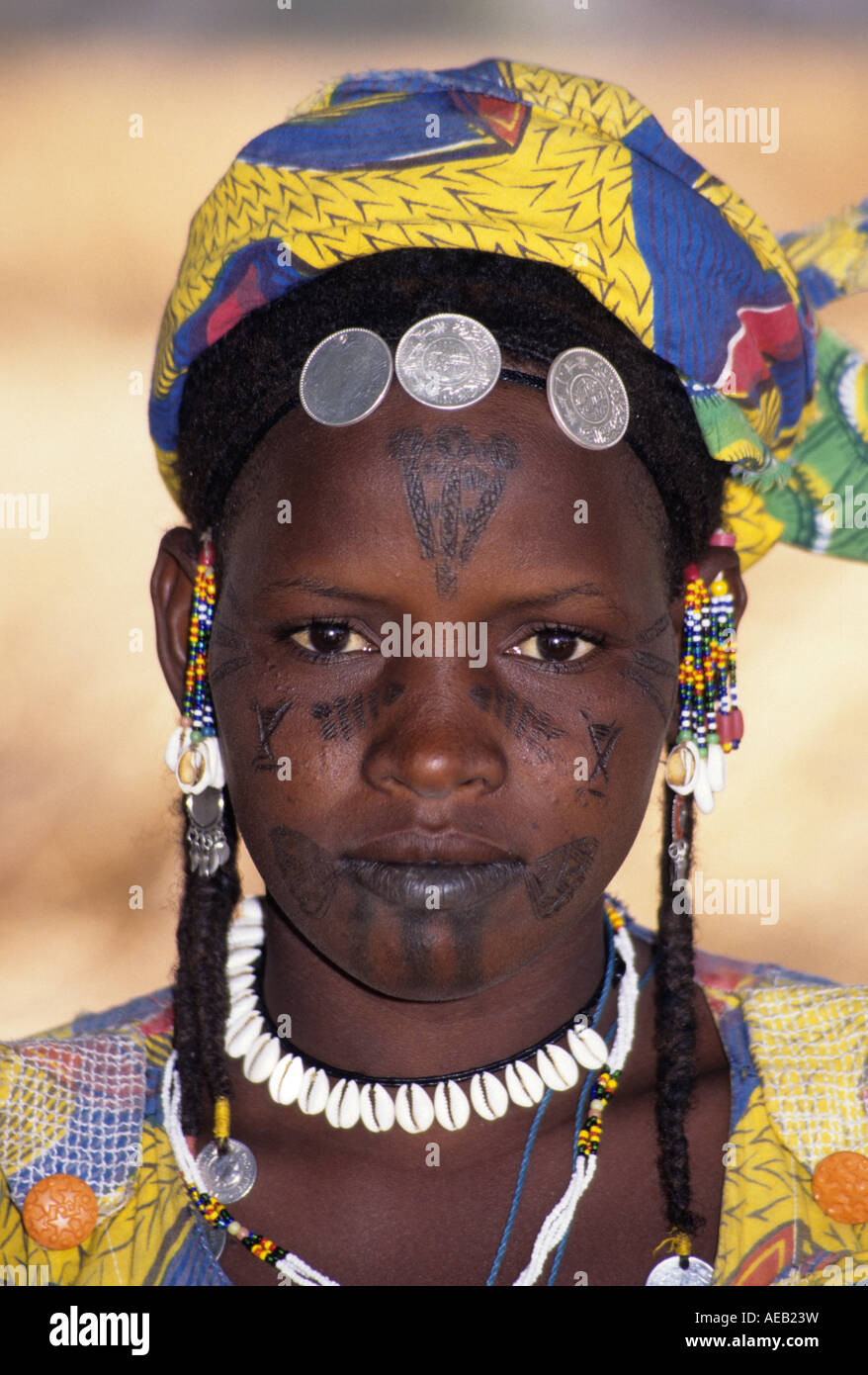 Delaquara, Niger. Fulani Girl with Facial Tattoos, Jewelry, Cowrie Shell Necklace Stock Photo