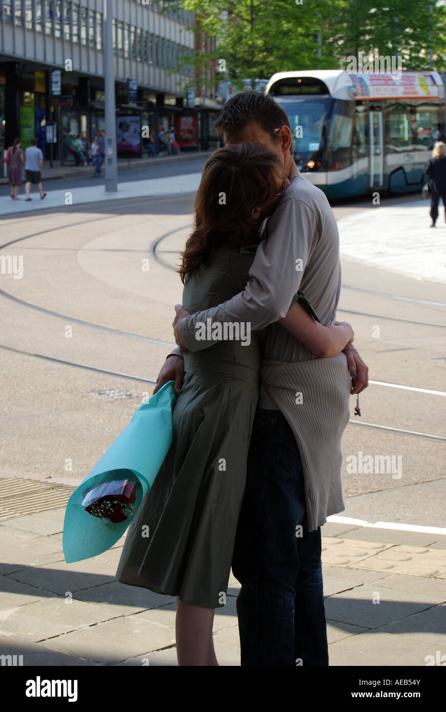Young couple kissing, Old Market Square, Nottingham, Nottinghamshire, England, United Kingdom Stock Photo